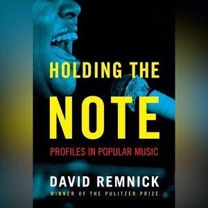 Holding The Note Book